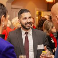 Rabih Jamal talking with two other party guests